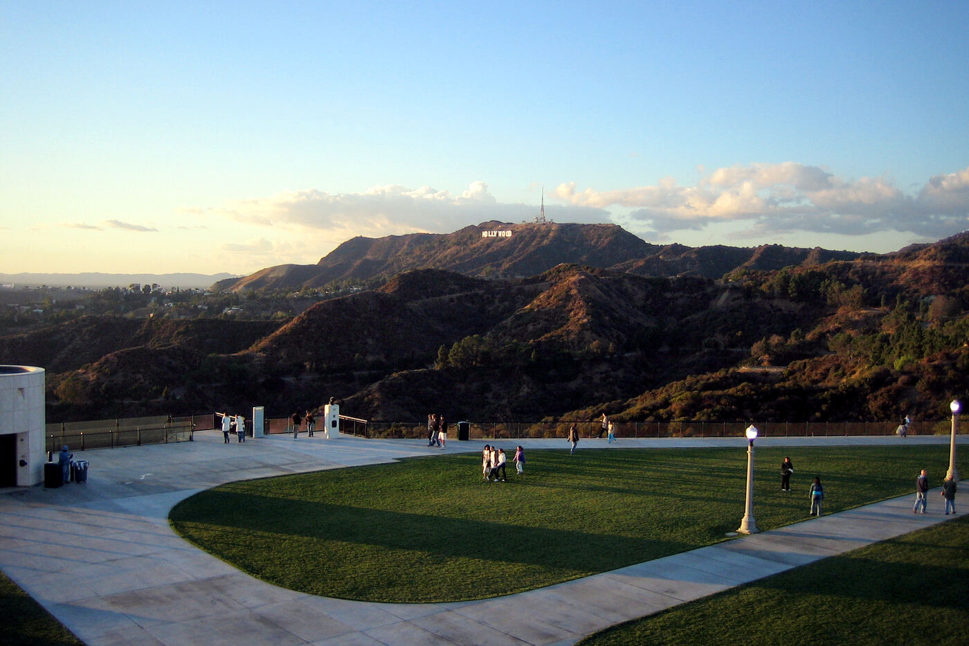 The lawn at Griffith Observatory with the Hollywood Sign on Mount Lee in the distance