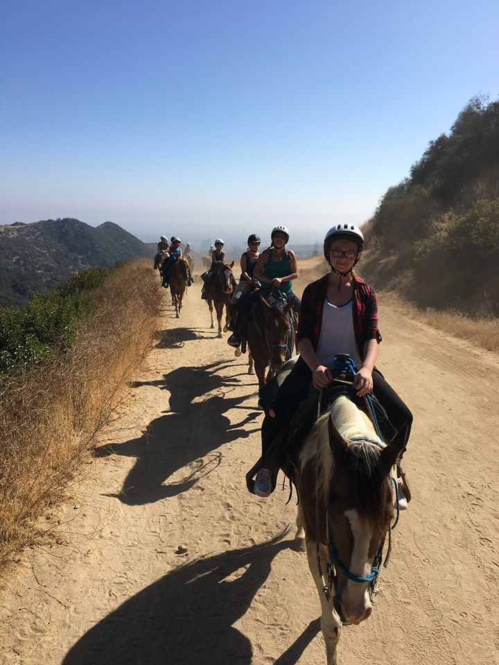 Riders on horseback heading along the trail at Sunset Ranch Hollywood