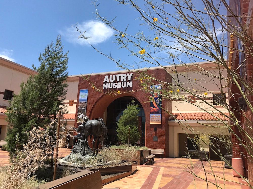 Autry Museum entrance with bronze horse statue and arched sign