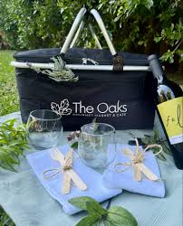 The Oaks Gourmet branded picnic basket with wine glasses